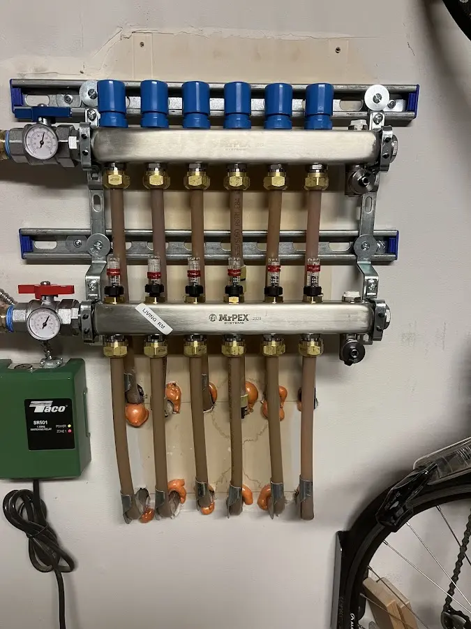 Plumber performing Water Heater Repair at a residential property in Wakefield